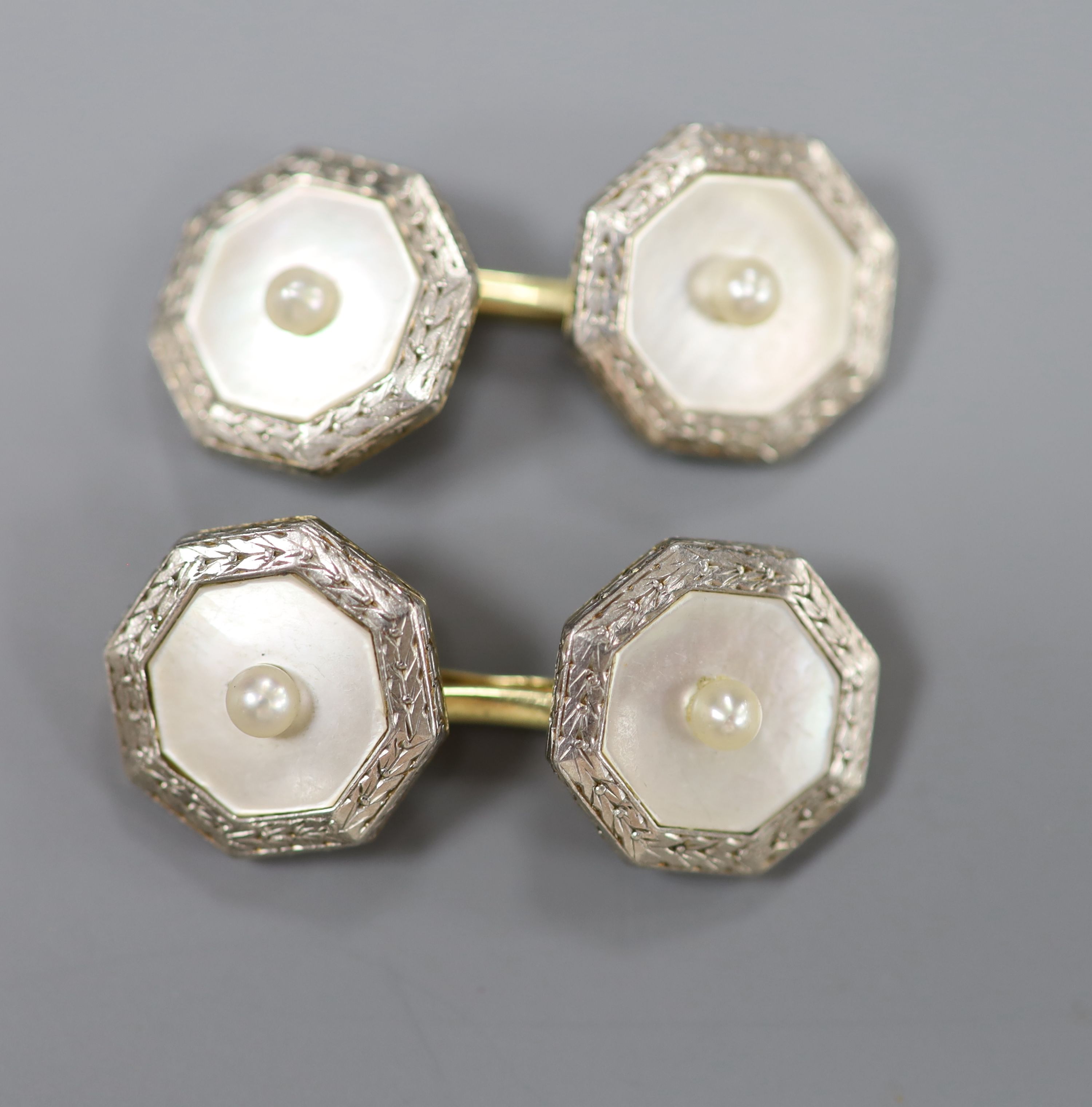 A pair of 1940s 14c, plat and mother of pearl octagonal cufflinks, gross 8 grams.